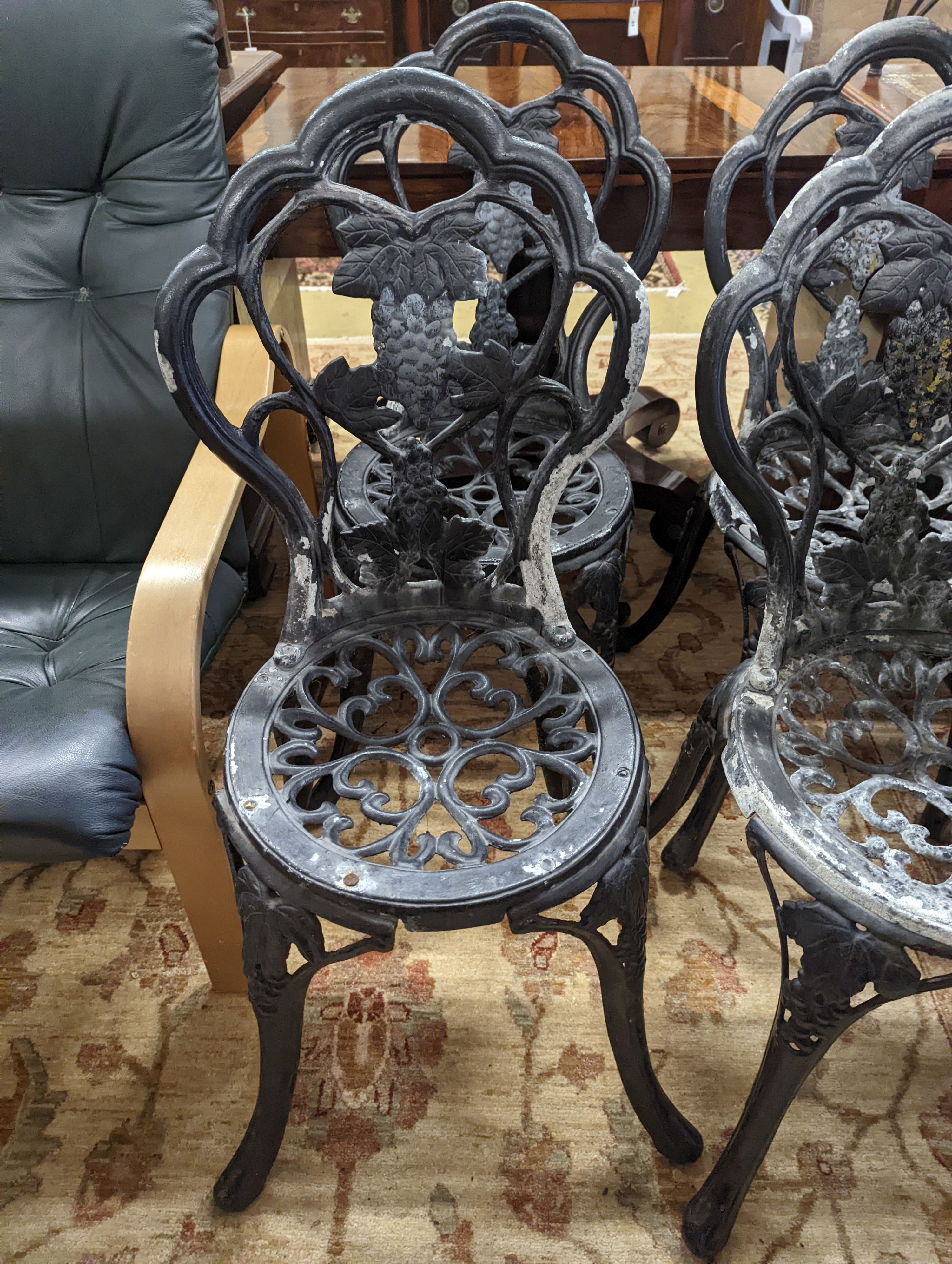 A set of four aluminium garden chairs